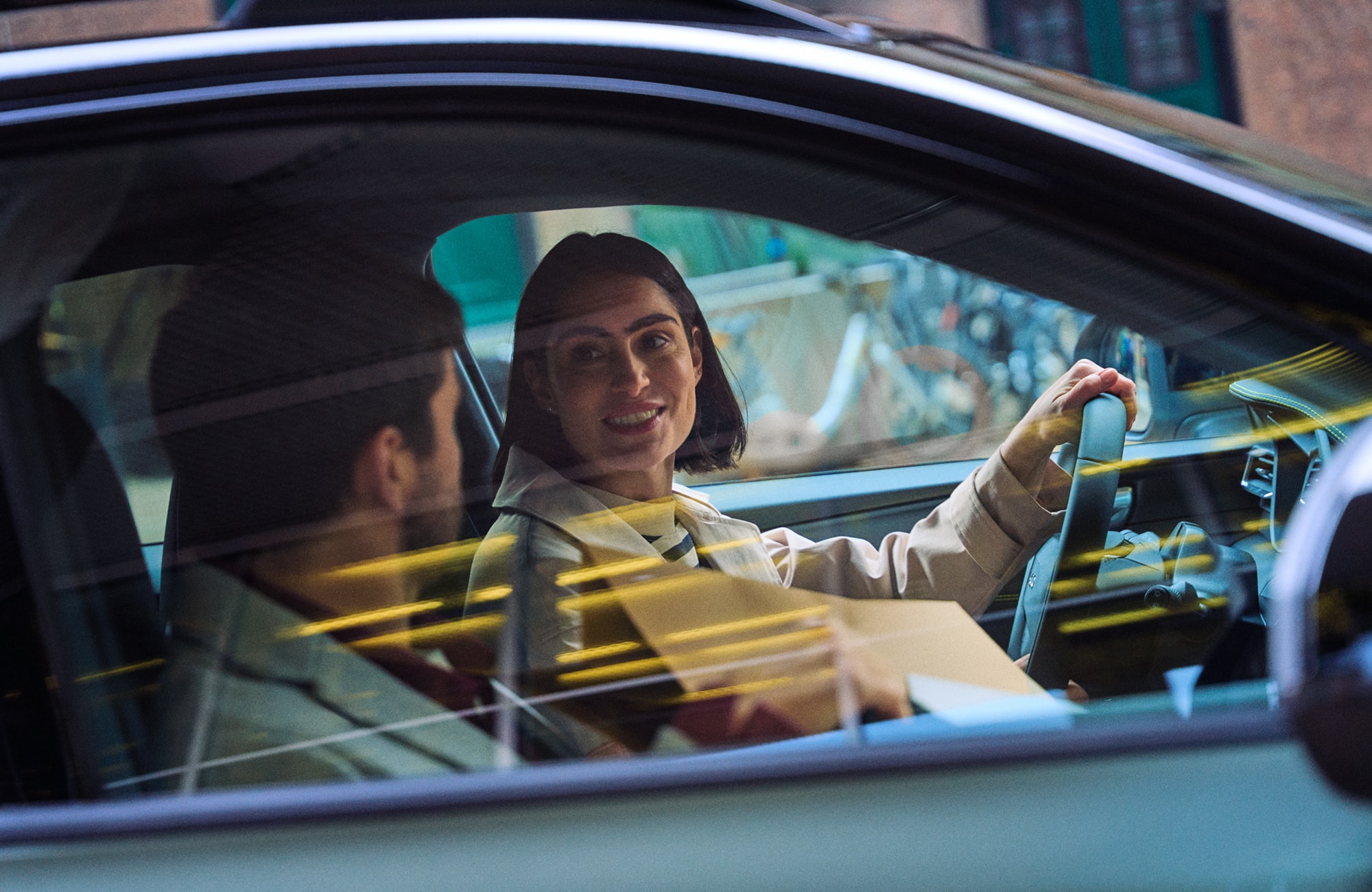 An image of a Lynk & Co with a women driving.