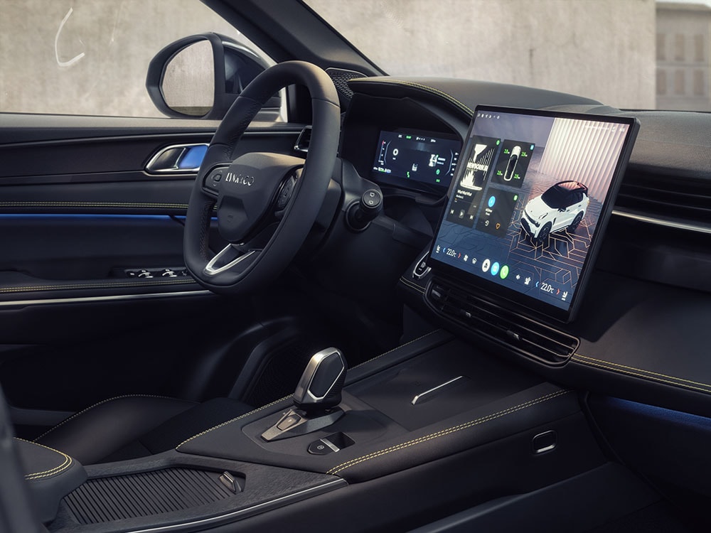 An image of a Lynk & Co car interior, showing the dashboard and front passenger door. The wing mirror is visible through the side window. 